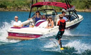 People boating and boarding on Table Rock Lake in Branson Missouri